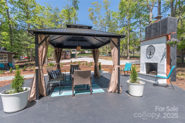 8 Palatka St, Arden, NC 28704 - view of patio / terrace featuring exterior fireplace and a gazebo
