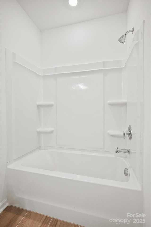 13709 Roderick Dr Unit 193, Huntersville, NC 28078 - full bathroom with bathtub / shower combination, wood finished floors, and baseboards