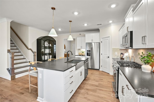 13709 Roderick Dr Unit 193, Huntersville, NC 28078 - kitchen featuring a kitchen breakfast bar, recessed lighting, appliances with stainless steel finishes, a sink, and dark countertops
