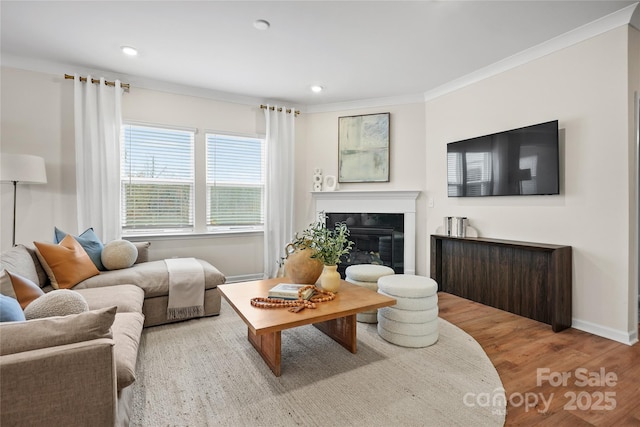 13709 Roderick Dr Unit 193, Huntersville, NC 28078 - living room with crown molding, a glass covered fireplace, recessed lighting, wood finished floors, and baseboards