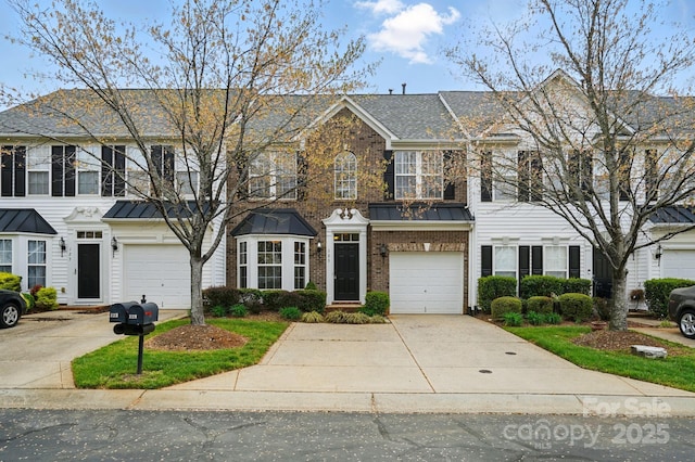 125 Snead Rd Unit 60, Fort Mill, SC 29715 - townhome / multi-family property featuring driveway, brick siding, a garage, and a standing seam roof