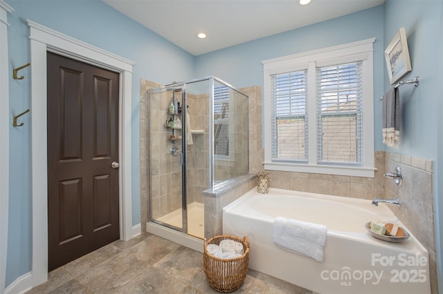 107 Iris Meadow Dr, Mooresville, NC 28115 - full bath featuring a shower stall, recessed lighting, and a garden tub