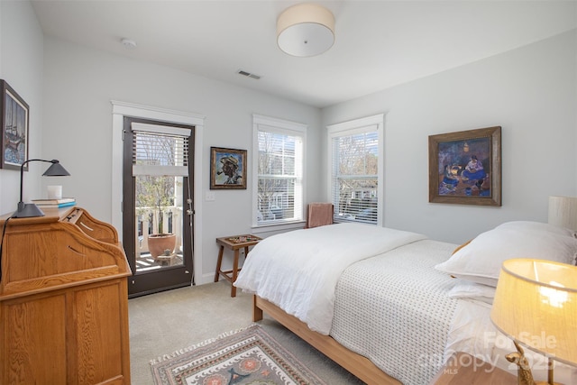 107 Iris Meadow Dr, Mooresville, NC 28115 - bedroom featuring access to exterior, visible vents, and light carpet