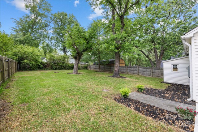 view of yard with a fenced backyard
