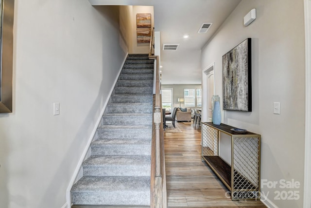 8038 Downy Oak Ln, Charlotte, NC 28269 - stairs with baseboards, visible vents, wood finished floors, and recessed lighting