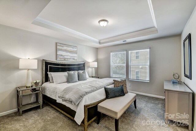 8038 Downy Oak Ln, Charlotte, NC 28269 - bedroom with visible vents, crown molding, baseboards, carpet floors, and a tray ceiling