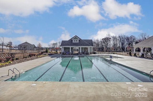 8038 Downy Oak Ln, Charlotte, NC 28269 - community pool featuring a patio, an outdoor structure, fence, and an exterior structure