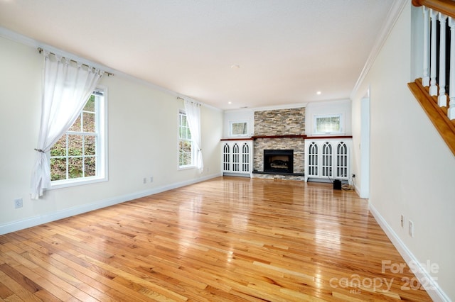 51 Sugar Hill Dr, Weaverville, NC 28787 - unfurnished living room with light wood-type flooring, baseboards, a fireplace, and ornamental molding