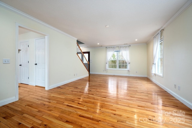 51 Sugar Hill Dr, Weaverville, NC 28787 - unfurnished living room featuring light wood-style floors, baseboards, stairs, and ornamental molding