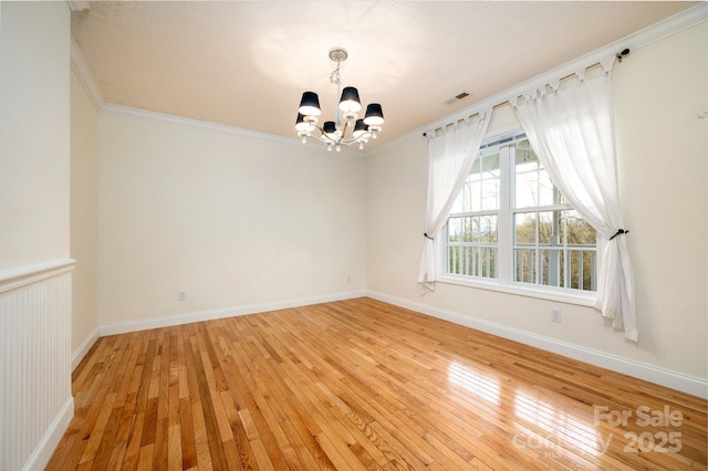51 Sugar Hill Dr, Weaverville, NC 28787 - empty room with an inviting chandelier, visible vents, crown molding, baseboards, and light wood-style flooring