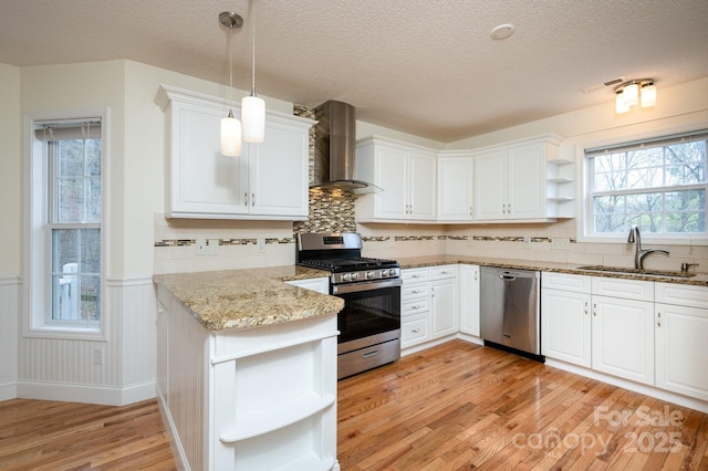 51 Sugar Hill Dr, Weaverville, NC 28787 - kitchen with light wood finished floors, open shelves, wall chimney range hood, a sink, and appliances with stainless steel finishes
