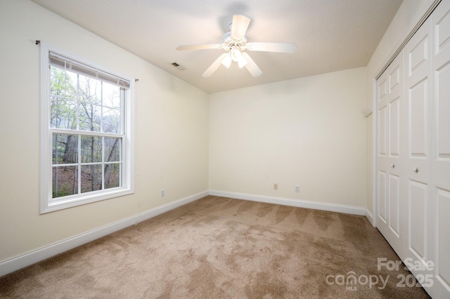51 Sugar Hill Dr, Weaverville, NC 28787 - unfurnished bedroom featuring visible vents, baseboards, a ceiling fan, a closet, and carpet floors