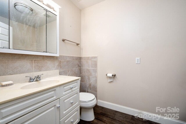 51 Sugar Hill Dr, Weaverville, NC 28787 - bathroom with wood finished floors, toilet, vanity, tile walls, and baseboards