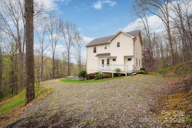 51 Sugar Hill Dr, Weaverville, NC 28787 - back of house featuring a wooden deck, driveway, and roof with shingles