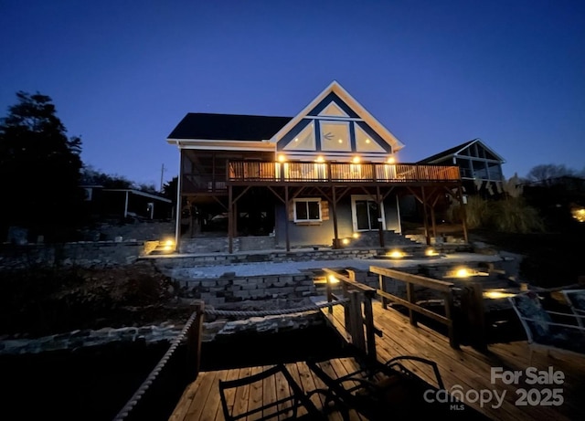 back of house with a wooden deck
