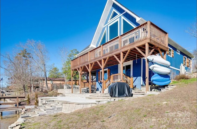 rear view of property with a deck