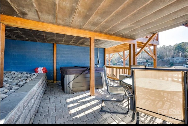 view of patio / terrace featuring a hot tub