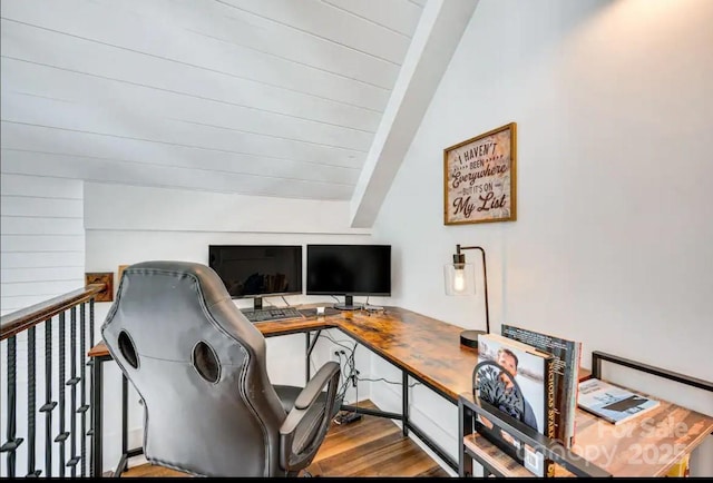 office with vaulted ceiling with beams and wood finished floors