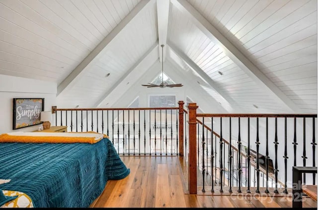 bedroom featuring wood-type flooring and lofted ceiling with beams