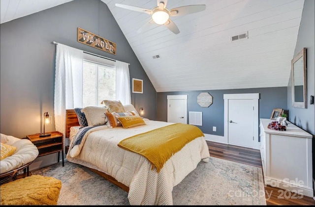 bedroom with visible vents, a ceiling fan, wood finished floors, and lofted ceiling