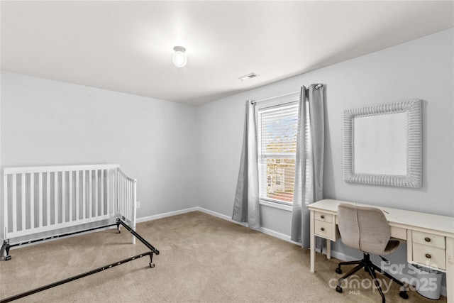 carpeted bedroom with visible vents and baseboards