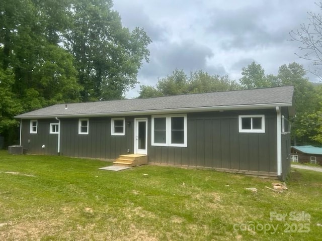 507 N Fork Rd, Black Mountain, NC 28711 - rear view of property featuring a yard, board and batten siding, and central AC
