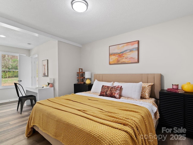 507 N Fork Rd, Black Mountain, NC 28711 - bedroom featuring wood finished floors and baseboards