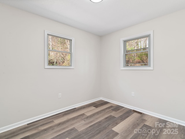 507 N Fork Rd, Black Mountain, NC 28711 - spare room with dark wood-type flooring and baseboards