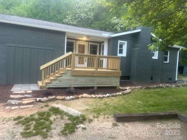 507 N Fork Rd, Black Mountain, NC 28711 - back of property with brick siding, a yard, and a deck