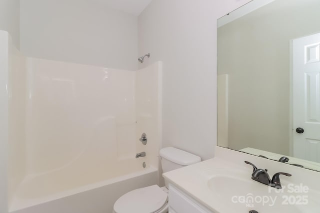 full bath featuring toilet, vanity, and washtub / shower combination