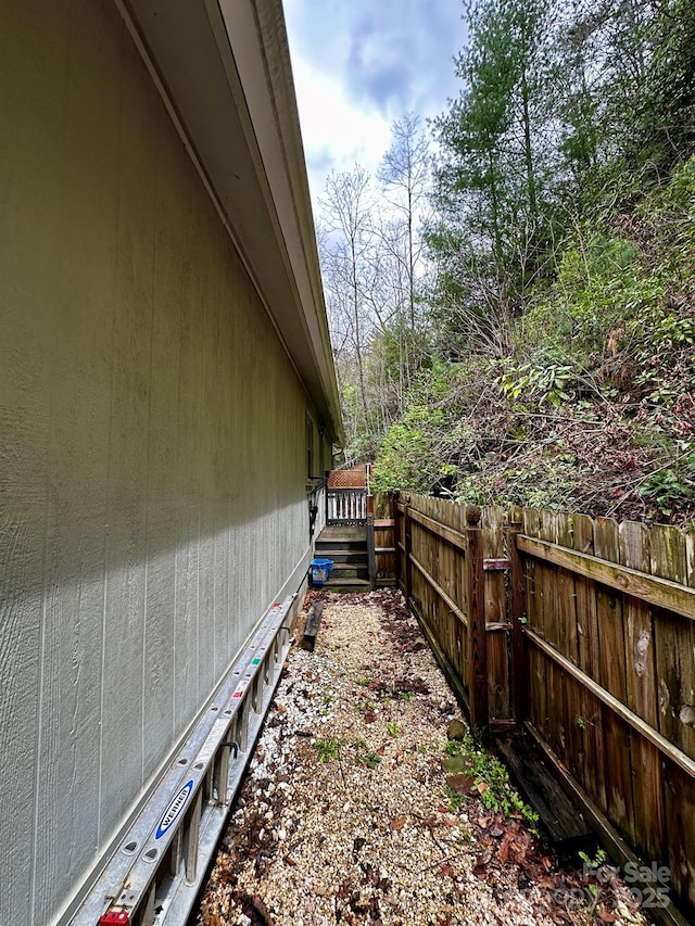 view of side of property with fence