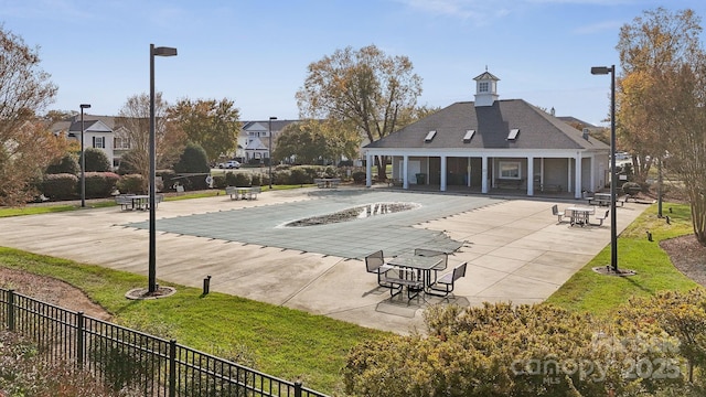 4211 Center Place Dr, Harrisburg, NC 28075 - view of community featuring a patio, fence, and a swimming pool