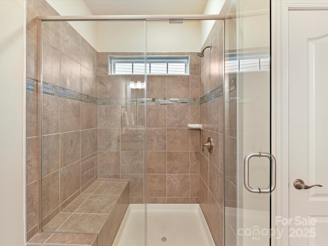 bathroom featuring a stall shower