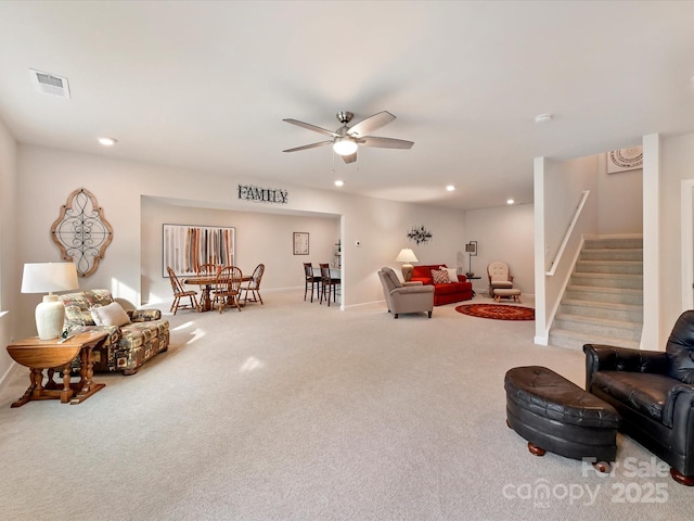carpeted living room with recessed lighting, stairway, visible vents, a ceiling fan, and baseboards