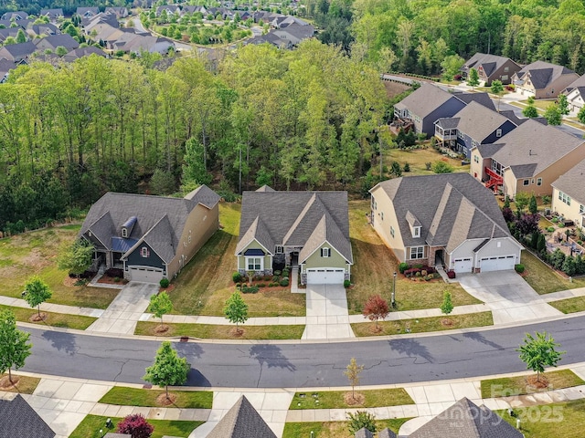 birds eye view of property with a residential view