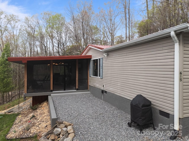 exterior space with a sunroom