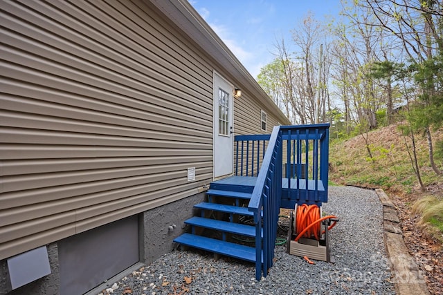 view of side of home with a deck