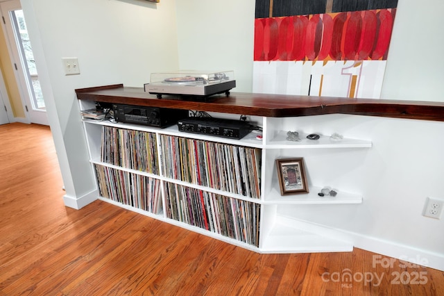 interior details featuring wood finished floors and baseboards