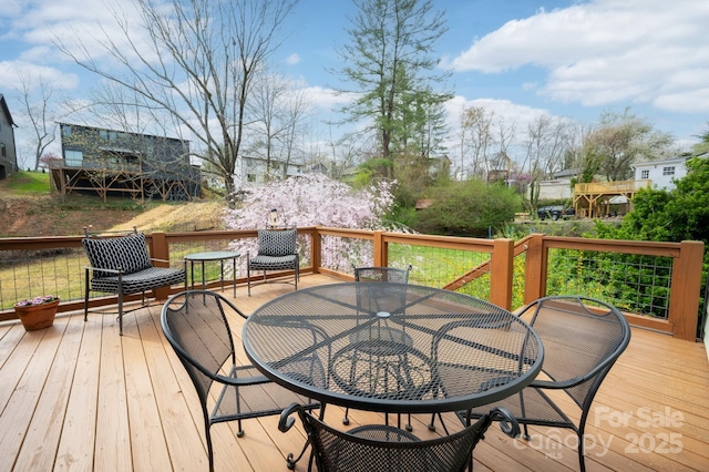 deck featuring outdoor dining space
