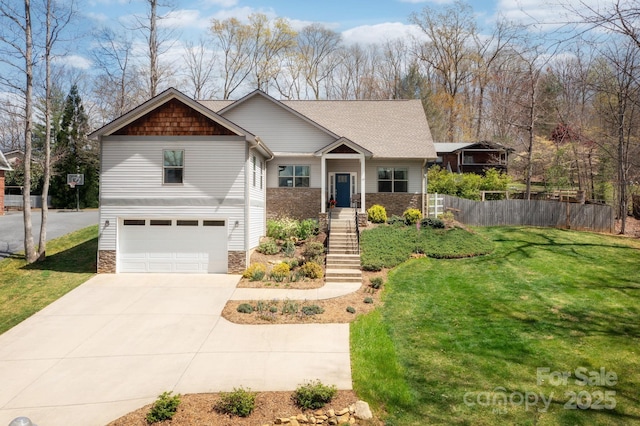 19 Dynasty Ln, Candler, NC 28715 - craftsman house with an attached garage, concrete driveway, a front yard, and fence