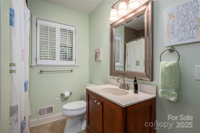 bathroom featuring a shower with curtain, vanity, toilet, visible vents, and baseboards