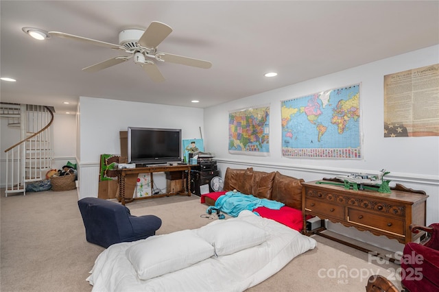 living area featuring stairway, a ceiling fan, carpet flooring, and recessed lighting