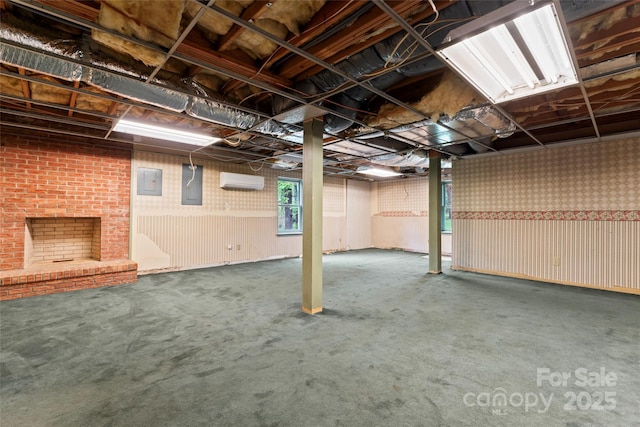 basement with carpet floors, electric panel, and a wall mounted air conditioner