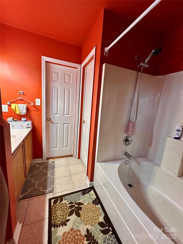 bathroom featuring tile patterned floors, vanity, and washtub / shower combination