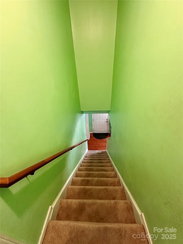 stairs with carpet flooring and baseboards