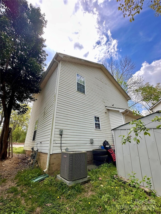 rear view of house with central AC