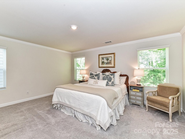 carpeted bedroom featuring ornamental molding, multiple windows, and baseboards