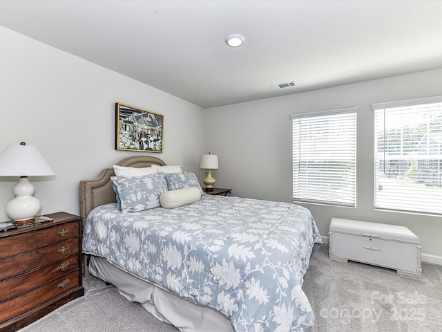 carpeted bedroom with baseboards