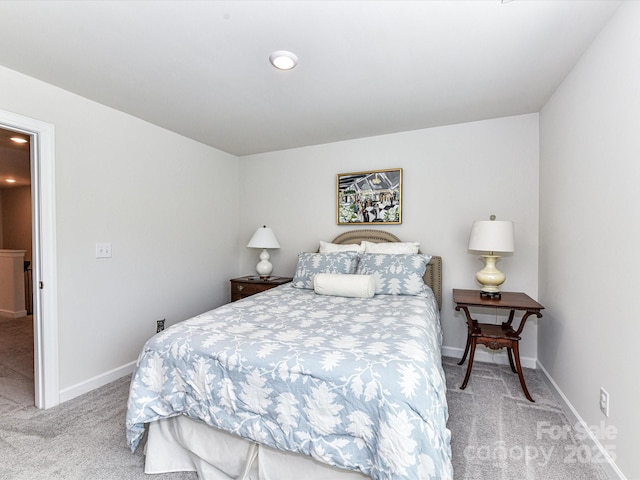 bedroom with carpet and baseboards