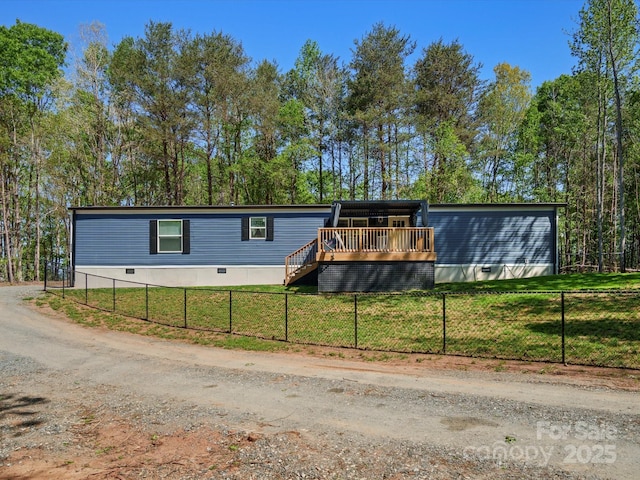 2234 Emerald Mine Rd, Shelby, NC 28152 - manufactured / mobile home with a wooden deck, crawl space, a front lawn, and a fenced front yard
